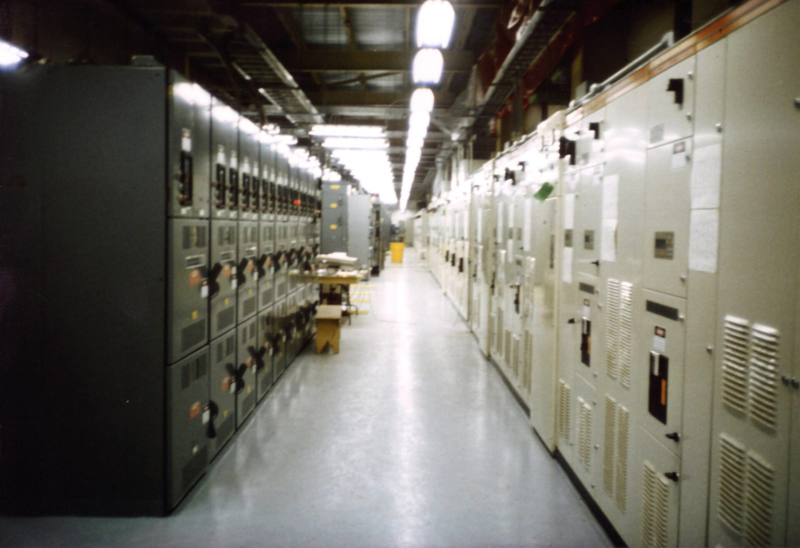 A line-up of switchgear panels in an electrical room.