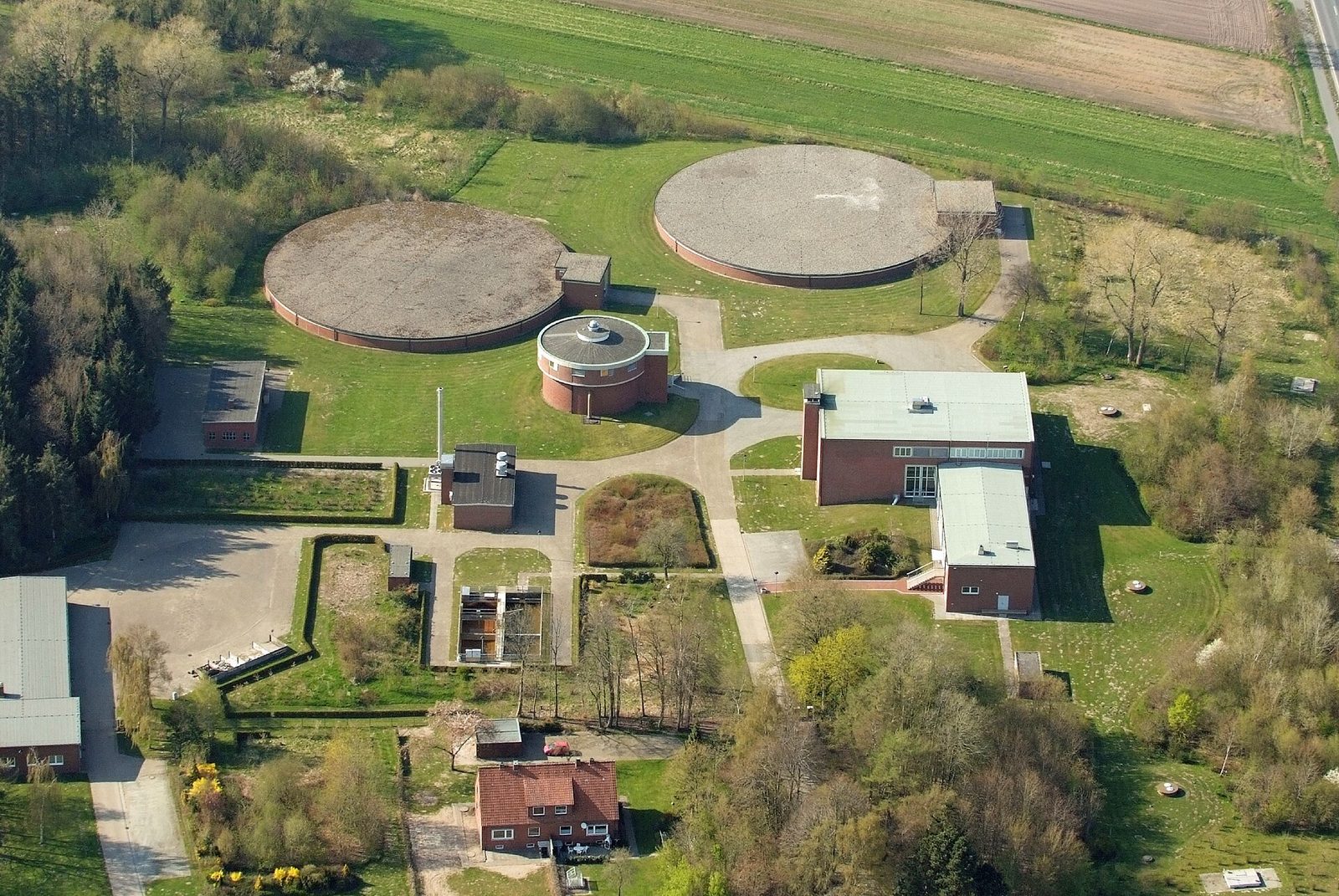 Aerial view of water storage tanks and a treatment site.